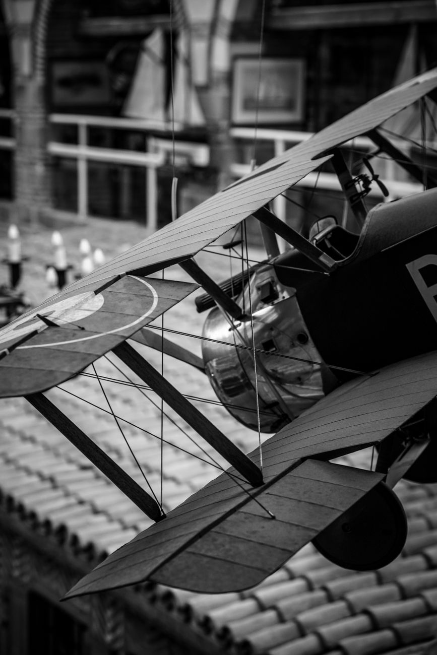 A completed balsa wood airplane model showing aerodynamic design and wooden frame construction details